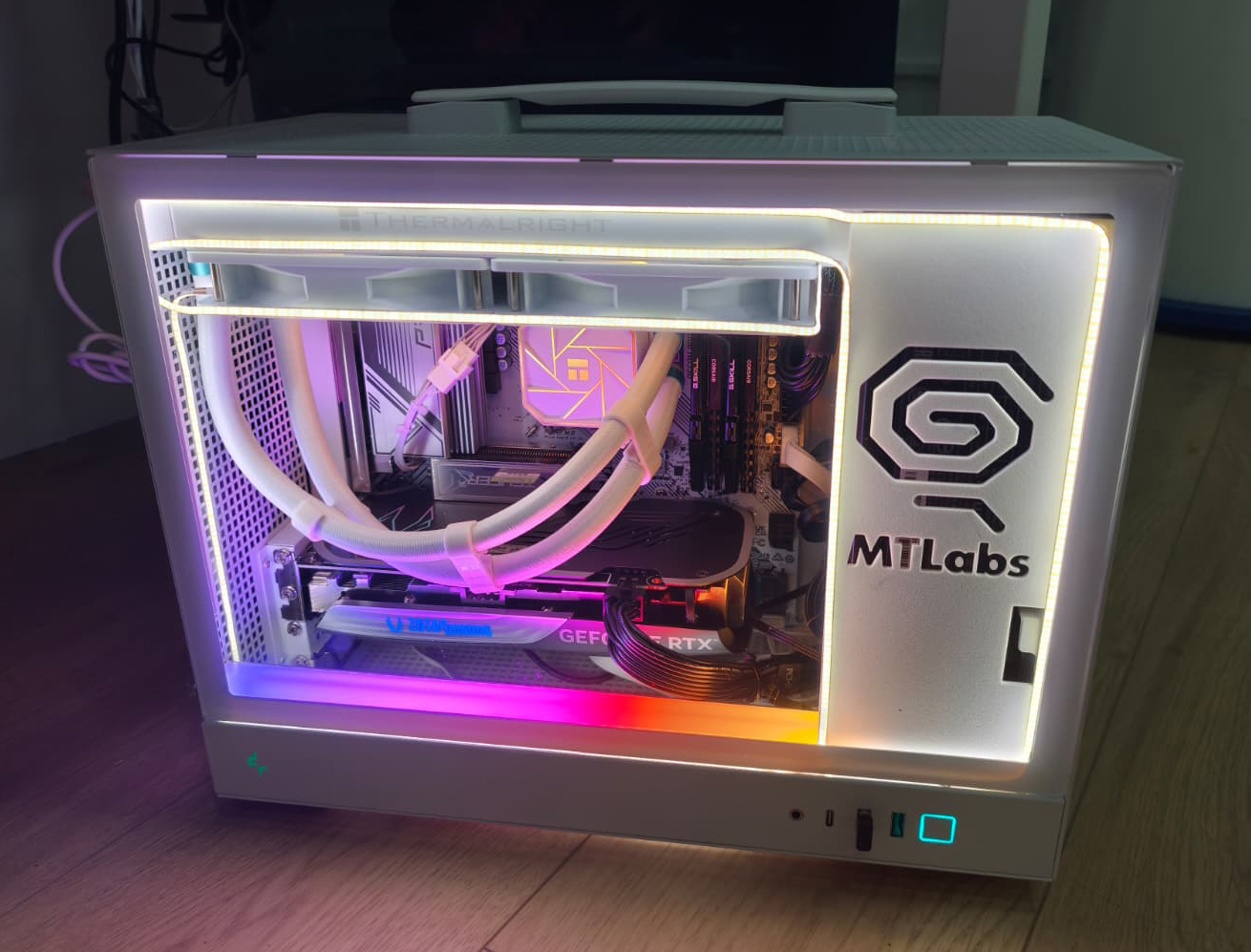 Modern white PC with RGB lighting and MT Labs branding on side panel